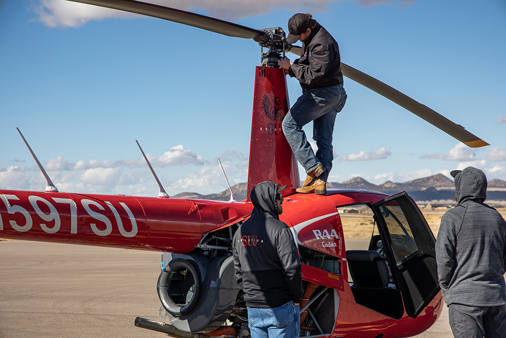 A&P Mechanics working on an R44 Helicopter