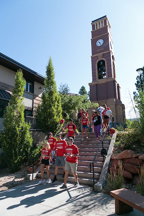 bell tower with students going down stairs