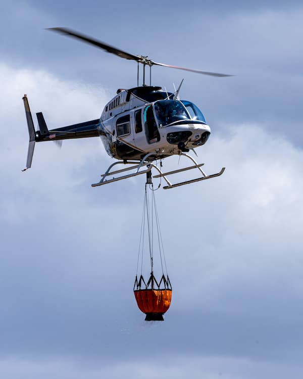 Helicopter carrying a basket